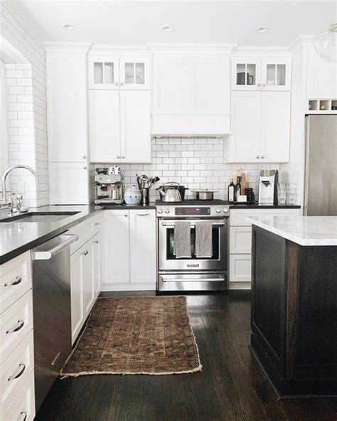 Infinity drains that virtually disappear. These White Kitchens With Dark Floors Are the Ultimate ...