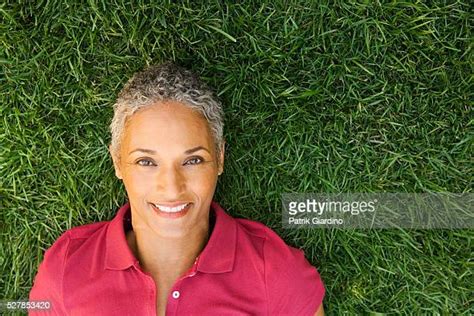 Mature Woman Laying Grass Photos And Premium High Res Pictures Getty