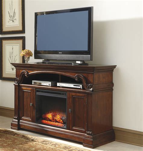 Harpan reddish brown small tv stand. Alymere Large TV Stand w/ Fireplace Option by Ashley ...