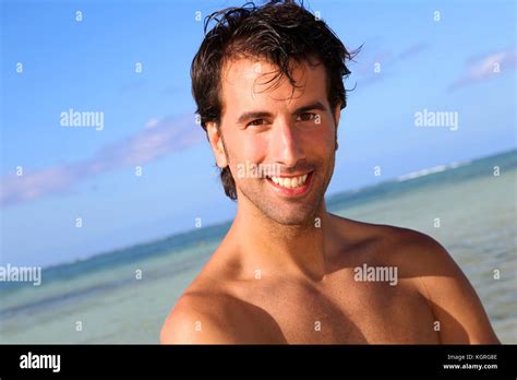 Handsome Man Standing On The Beach Stock Photo Alamy