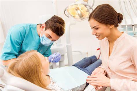 Premium Photo Pediatric Dentist Examining Young Patient With Her