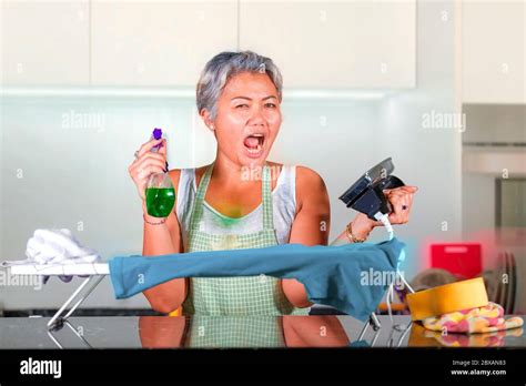 Mature Woman Suffering Domestic Work Stress Attractive And Stressed Asian Middle Aged Lady