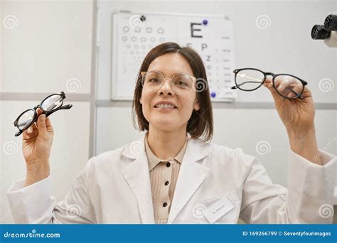 Female Optometrist Holding Glasses Stock Image Image Of Eyewear