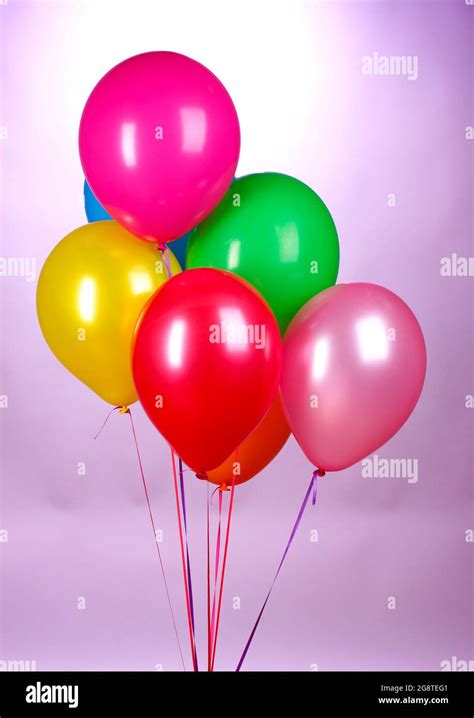 Bright Balloons On Purole Background Stock Photo Alamy