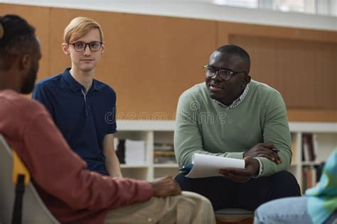 Black Young Man As Mental Health Therapist In Support Group Session