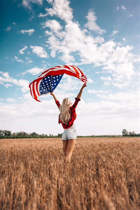 Woman Holding An American Flag In A Field Free Stock Photo Picjumbo