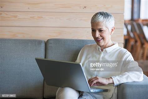 Mature Woman Celebrate Laptop Photos And Premium High Res Pictures Getty Images