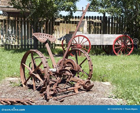 Old Farm Equipment In The Garden Stock Photo Image Of Equipment
