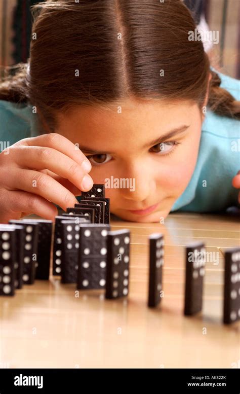 Girl Playing Dominoes Stock Photo Alamy