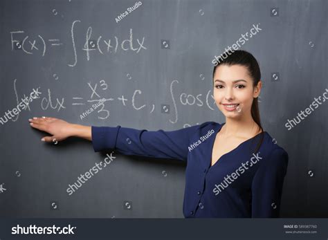 Beautiful Young Teacher Explaining Math Formulas Stock Photo 589387760