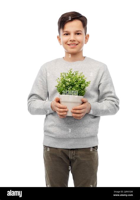 Happy Smiling Boy Holding Flower In Pot Stock Photo Alamy