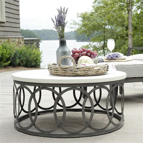 Round Outdoor Coffee Table With Wrought Base And Faux Stone Top Chic