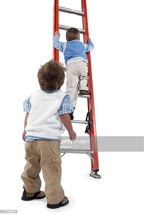 Boys Climbing Ladder High Res Stock Photo Getty Images