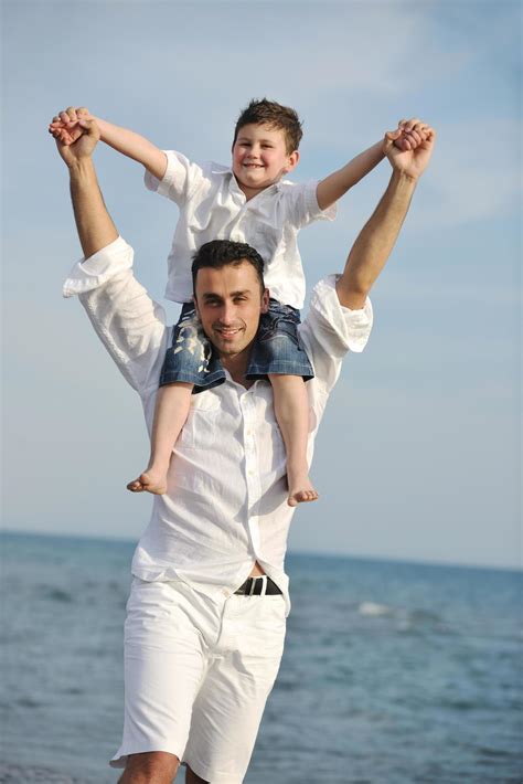 Happy Father And Son Have Fun And Enjoy Time On Beach 12654599 Stock