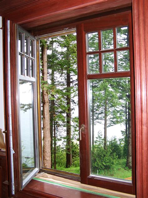 An Open Window With The View Of Trees Outside