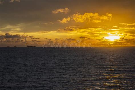 Sunset In The Offshore Area Fpso And Other Vessels Together In An