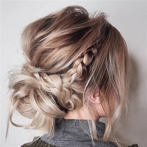 They can easily be intertwined into an updo that's both charismatic and flashy. 10 Updos for Medium Length Hair from Top Salon Stylists