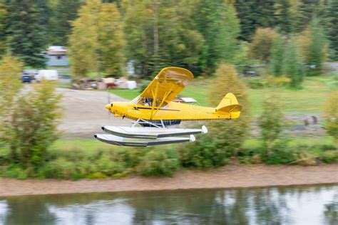 Bush Float Plane Flying Over River In Alaska Stock Photo Image Of
