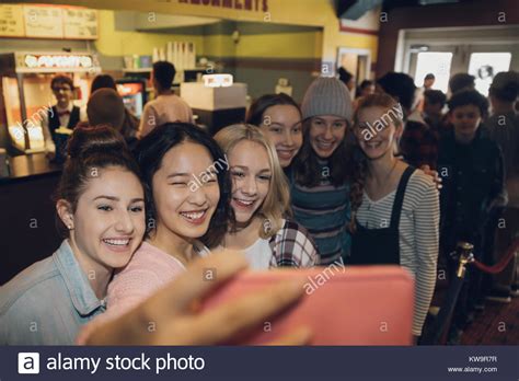 Smilinghappy Tween Girl Friends Taking Selfie With Smart Phone In