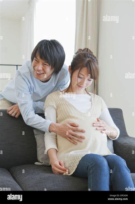 Man Touching His Pregnant Wifes Belly Stock Photo Alamy