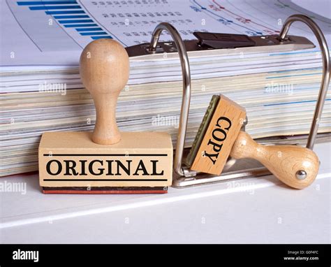 Original And Copy Two Stamps In The Office Stock Photo Alamy