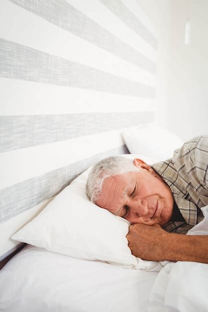 Premium Photo Senior Man Sleeping On Bed In Bedroom