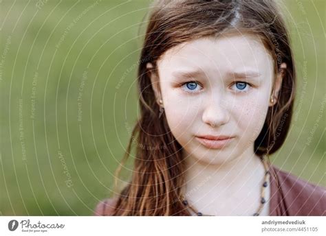 Portrait Of Sad Crying Emotional Cute Little Girl Looking At Camera