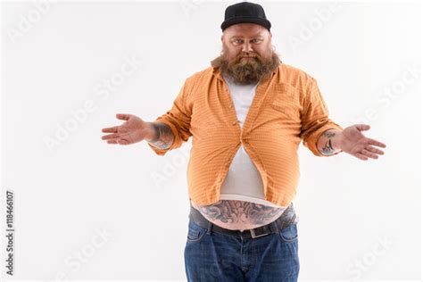 Man Wearing A Shirt That Is Too Small On Him Buy This Stock Photo And
