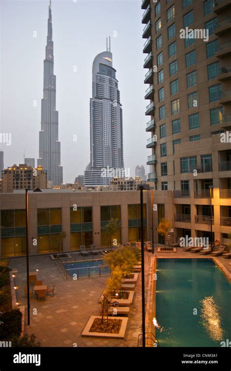 Burj Khalifa Dubai And Downtown Address Tower At Sunset Seen From