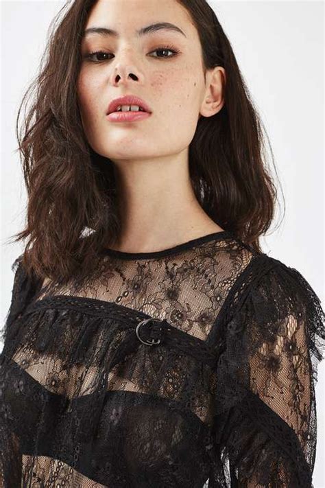 Sheer Tops Are A Party Staple For Now This Long Sleeve Style Is
