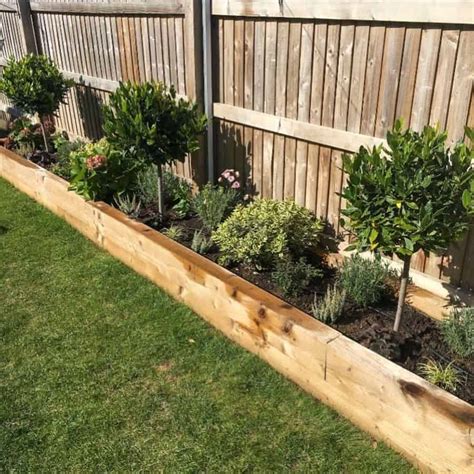 How To Build Raised Garden Bed Along Fence Garden Design Ideas