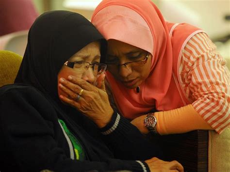 families of victims of malaysia airlines flight mh370 tragedy face agonizing wait as officials