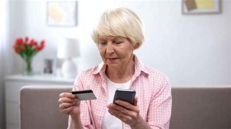 Confused Grandma Using Smart Phone Stock Photos Pictures And Royalty