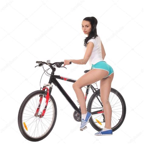 Ragazza Sexy Con Una Bicicletta Su Uno Sfondo Bianco Foto Stock Foto Immagini © Zhagunov