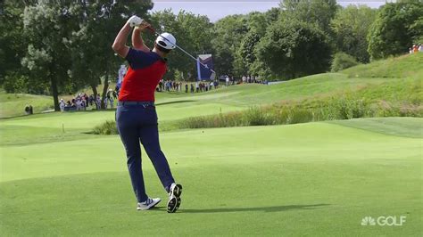 Rahm uses his physique and strength to make a simple swing. Jon Rahm iron swing in slow motion | Golf Channel