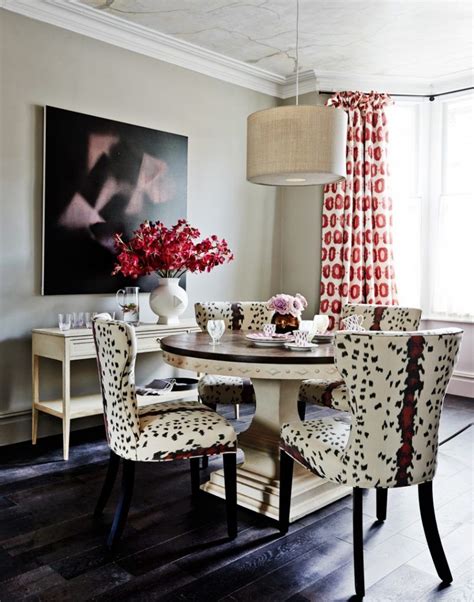 .blue animal print dining chairs and white and pink french bergere head chairs placed on a gray dining room features wooden french cane chairs at a brown wooden oval trestle dining table over french cane chairs with an antique oval table in a cottage dining room boasting a blue stripe rug. 20 Awesome Zebra Dining Room Chairs - 2019 | Fabric dining ...