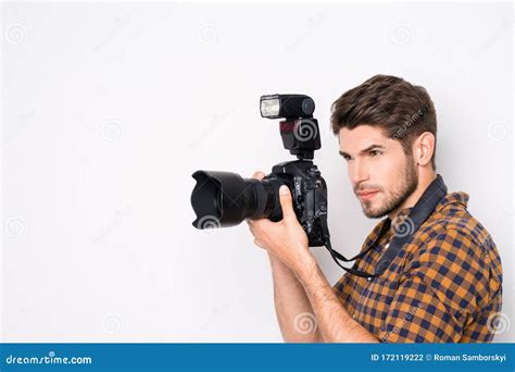 Portrait Of Young Handsome Professional Photographer Taking Photo Stock