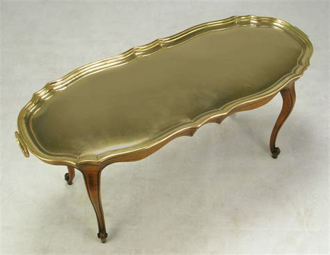 The gold and black hues double as an accent piece and functional furniture in the living room. Yale Burge Louis XV Style Coffee Table With Solid Brass ...