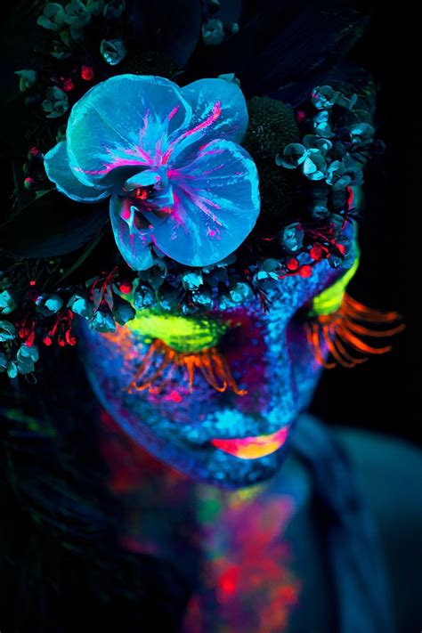 Girl With Flower In Her Hair And Neon Color Face Makeup Art Dark Beauty