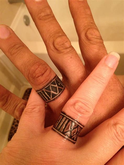 Infinity symbol designed ring tattoo for couple. Wedding band tattoos custom from Rosario Tattoos in Tampa ...