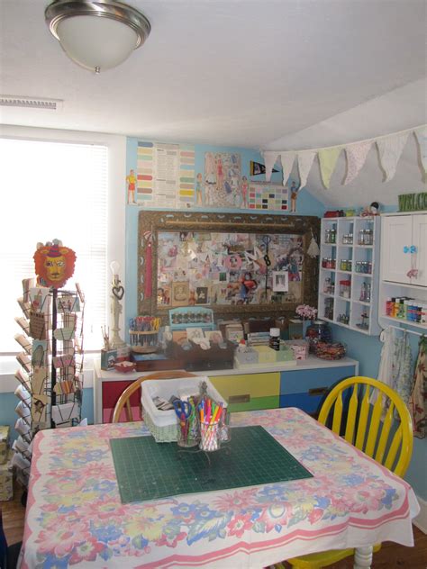 Our fingers are itching for a craft room makeover. Work table in my craft room with one of my many vintage ...