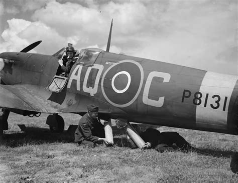 Ground Crew Loading A Dinghy Into A Spitfire Mk Iia Serial P8131 Aq C