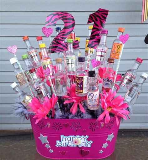 What to put in a birthday basket. Pink alcohol tree gift | 21st birthday basket, Birthday ...