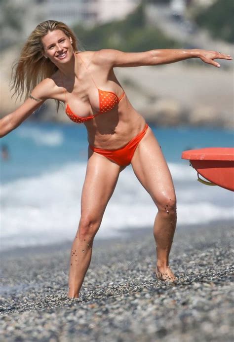 Michelle Hunziker In An Orange Bikini On The Beach In Varigotti Celebsla Com