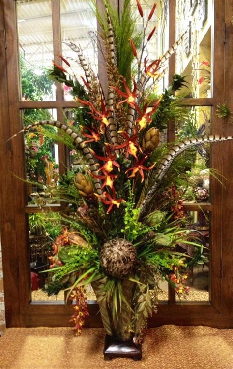 The glue turned the petals a little gray, but they. Arranged in an aged resin urn, these festive fall florals ...