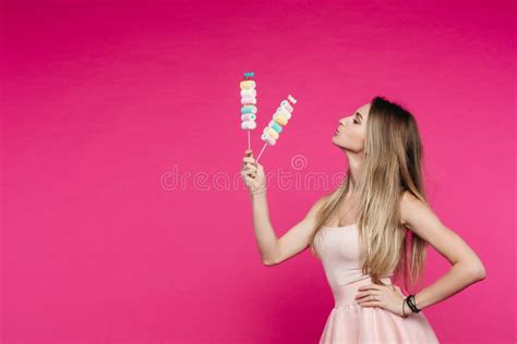 Funny Girl Like Doll With Marshmallow Candy On Stick Stock Photo