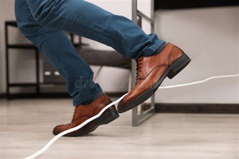 Man Tripping Over Cord In Office Closeup Stock Image Image Of Cord