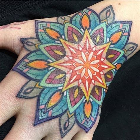 Colored Mandala Tattoo On The Left Hand