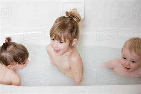 Smiling Caucasian Boy And Girls In Bathtub Stock Photo Dissolve