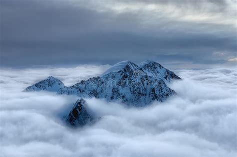 Snowy Peak Above The Clouds Stock Photo Image Of Rock Snow 117791408